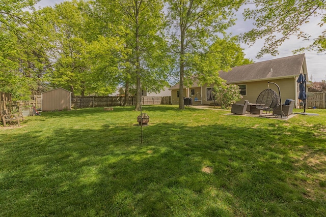 1373 Kristen Path, Saint Joseph, MI 49085 - view of yard featuring an outdoor fire pit and a patio area