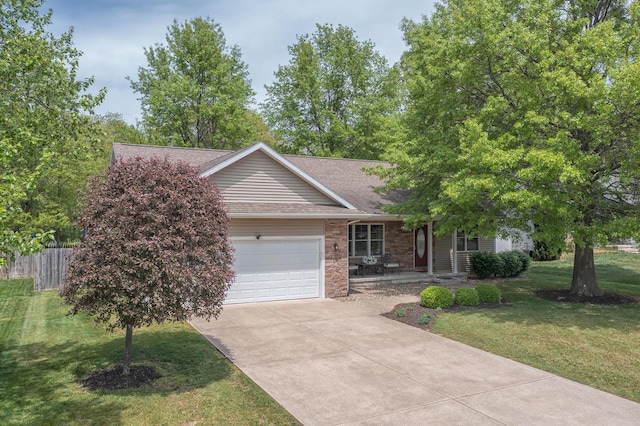 1373 Kristen Path, Saint Joseph, MI 49085 - view of front facade featuring an attached garage, driveway, roof with shingles, and a porch