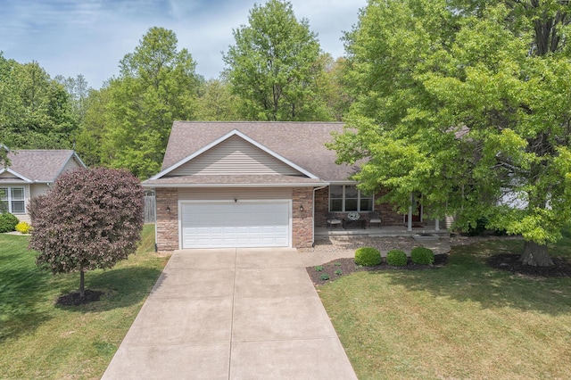 1373 Kristen Path, Saint Joseph, MI 49085 - view of front of property with a garage, a front yard, and concrete driveway
