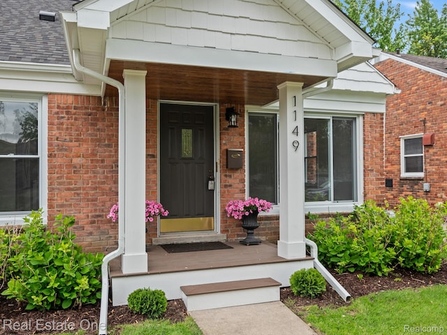 1149 Larkmoor Blvd, Berkley, MI 48072 - view of exterior entry with a porch and brick siding