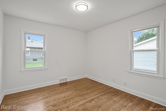 1149 Larkmoor Blvd, Berkley, MI 48072 - unfurnished room with plenty of natural light, baseboards, and light wood finished floors