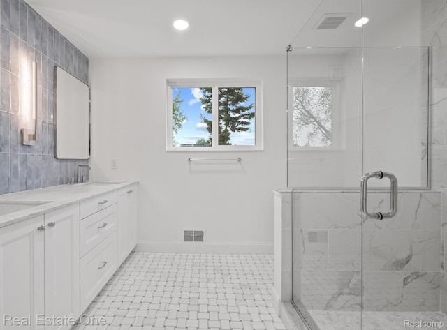 1149 Larkmoor Blvd, Berkley, MI 48072 - full bath with plenty of natural light, double vanity, a marble finish shower, baseboards, and recessed lighting