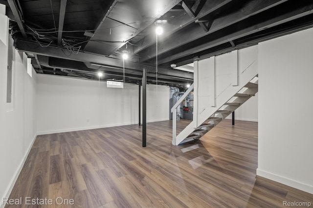 1149 Larkmoor Blvd, Berkley, MI 48072 - finished basement with stairway, wood finished floors, and baseboards