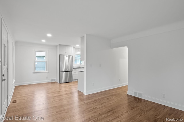 1149 Larkmoor Blvd, Berkley, MI 48072 - unfurnished room with a sink, light wood-type flooring, recessed lighting, and baseboards