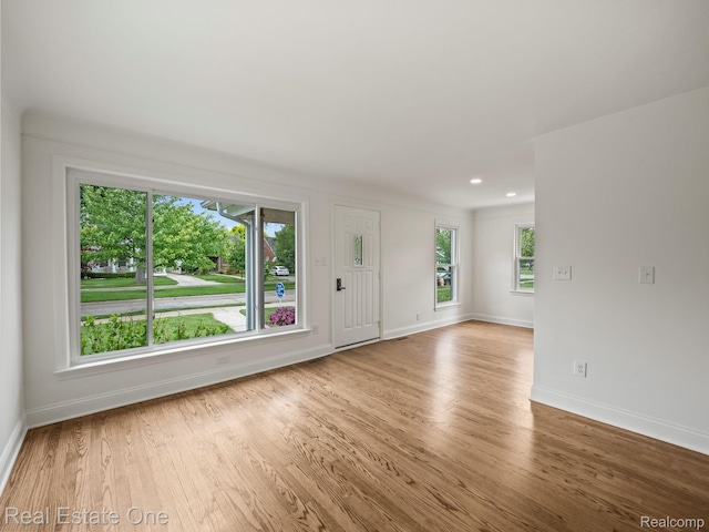 1149 Larkmoor Blvd, Berkley, MI 48072 - unfurnished living room with wood finished floors, baseboards, and recessed lighting