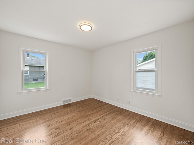 1149 Larkmoor Blvd, Berkley, MI 48072 - spare room featuring light wood finished floors, healthy amount of natural light, and baseboards