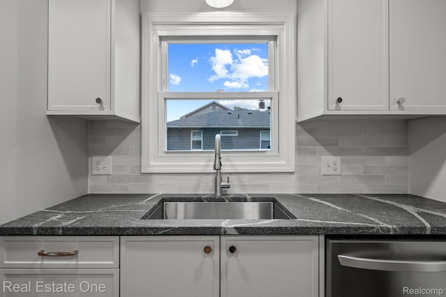 1149 Larkmoor Blvd, Berkley, MI 48072 - kitchen featuring a sink, dishwasher, white cabinets, decorative backsplash, and dark stone counters