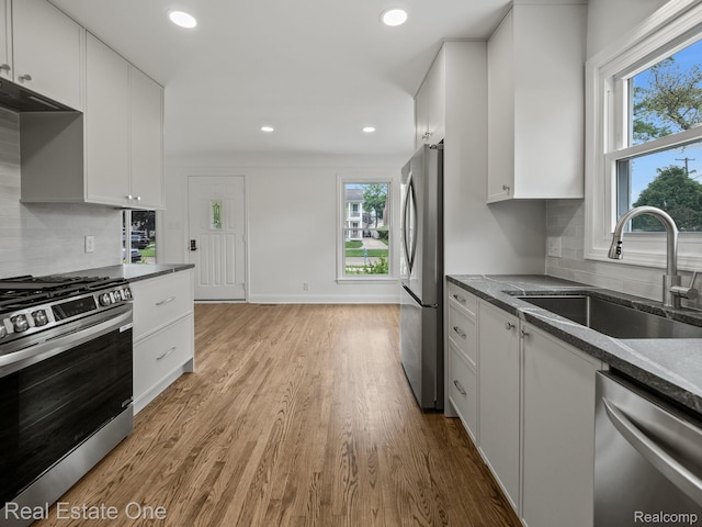 1149 Larkmoor Blvd, Berkley, MI 48072 - kitchen featuring appliances with stainless steel finishes, a sink, wood finished floors, white cabinetry, and recessed lighting