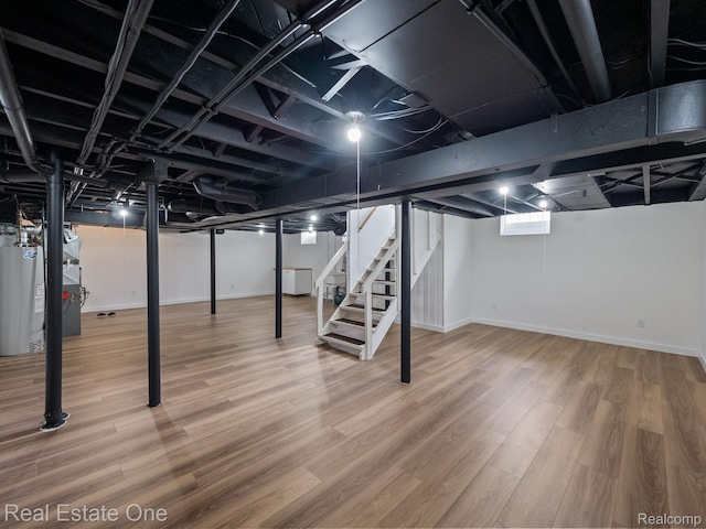 1149 Larkmoor Blvd, Berkley, MI 48072 - finished basement with water heater, stairway, baseboards, and wood finished floors