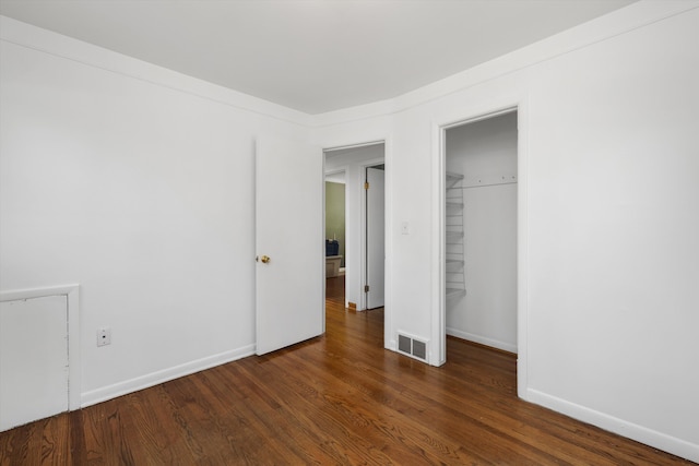 22637 Karam Ct, Warren, MI 48091 - unfurnished bedroom with wood finished floors, a closet, and baseboards