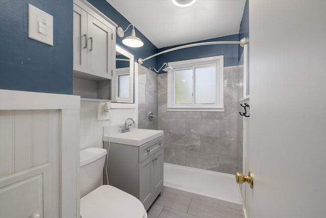 22637 Karam Ct, Warren, MI 48091 - bathroom featuring a tile shower, toilet, tile patterned flooring, and vanity