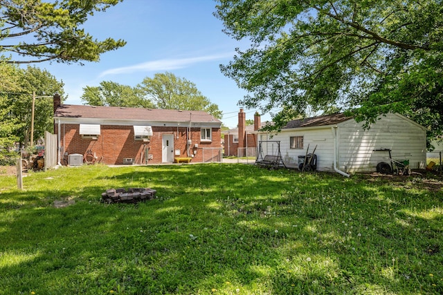 22637 Karam Ct, Warren, MI 48091 - rear view of house with a chimney, brick siding, and a gate
