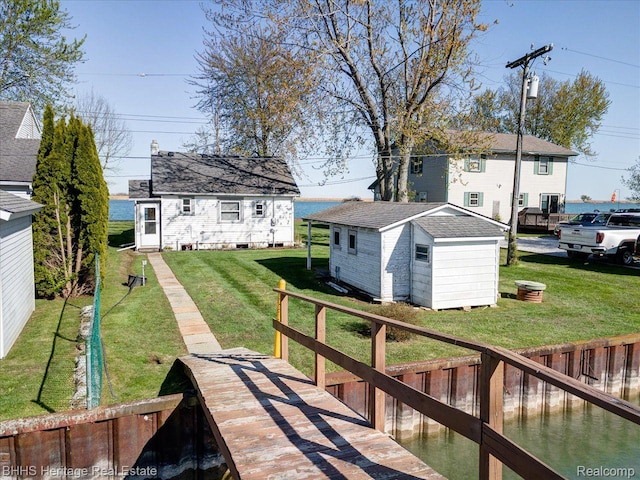 5222 S Channel Dr, Harsens Island, MI 48028 - dock featuring a lawn