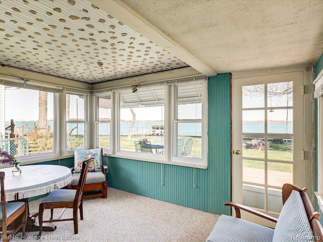 5222 S Channel Dr, Harsens Island, MI 48028 - sunroom featuring carpet floors, healthy amount of natural light, a water view, and a textured ceiling