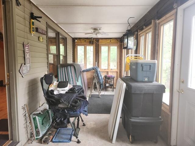 9332 W 10 Mile Rd, Irons, MI 49644 - sunroom / solarium featuring a ceiling fan, french doors, and wooden walls