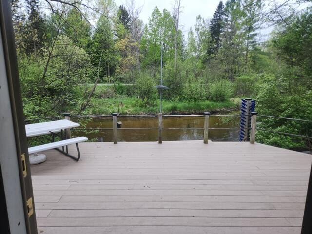9332 W 10 Mile Rd, Irons, MI 49644 - wooden terrace featuring a water view