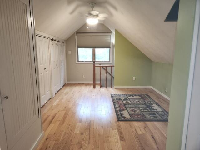 9332 W 10 Mile Rd, Irons, MI 49644 - additional living space featuring ceiling fan, light wood-type flooring, baseboards, and vaulted ceiling