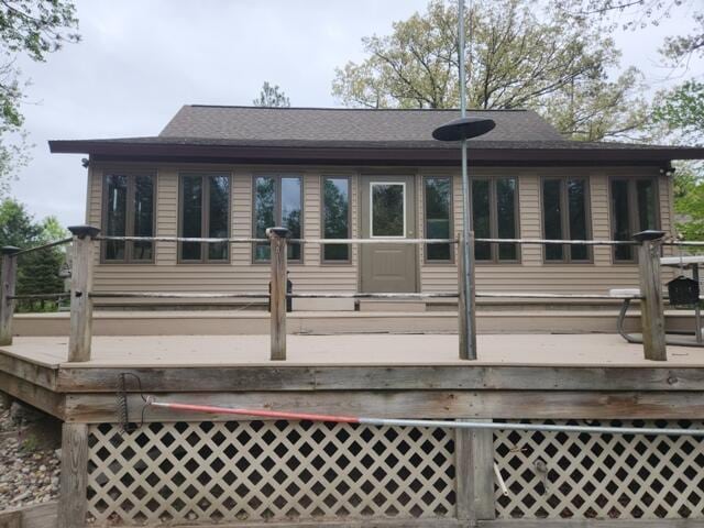9332 W 10 Mile Rd, Irons, MI 49644 - back of house with a deck