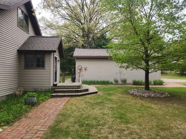 9332 W 10 Mile Rd, Irons, MI 49644 - view of grassy yard