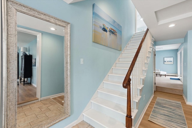 3761 Hunt Rd, Lapeer, MI 48446 - stairs featuring baseboards, recessed lighting, and wood finished floors
