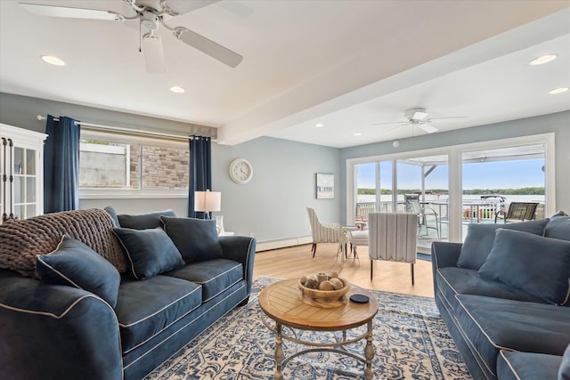 3761 Hunt Rd, Lapeer, MI 48446 - living room featuring a ceiling fan, healthy amount of natural light, light wood-style flooring, recessed lighting, and a baseboard heating unit