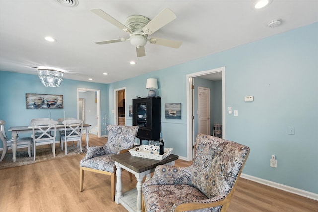 3761 Hunt Rd, Lapeer, MI 48446 - living area featuring light wood-style flooring, baseboards, a ceiling fan, and recessed lighting