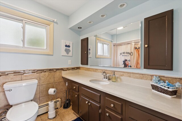 3761 Hunt Rd, Lapeer, MI 48446 - bathroom featuring a baseboard heating unit, tile walls, tile patterned flooring, toilet, and vanity