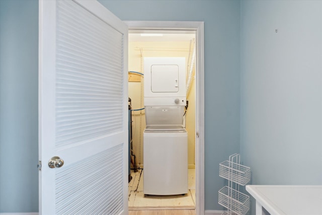 3761 Hunt Rd, Lapeer, MI 48446 - laundry room featuring stacked washing machine and dryer