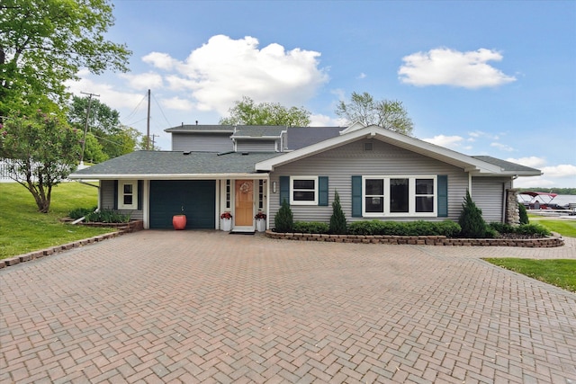3761 Hunt Rd, Lapeer, MI 48446 - ranch-style home featuring an attached garage, decorative driveway, a front yard, and a shingled roof
