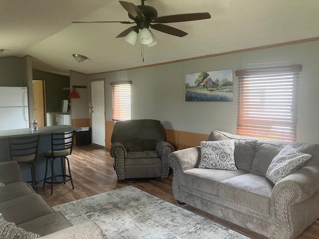 515 E Pond Vw, Morrice, MI 48857 - living room with a wainscoted wall, ceiling fan, wood finished floors, lofted ceiling, and washer / dryer
