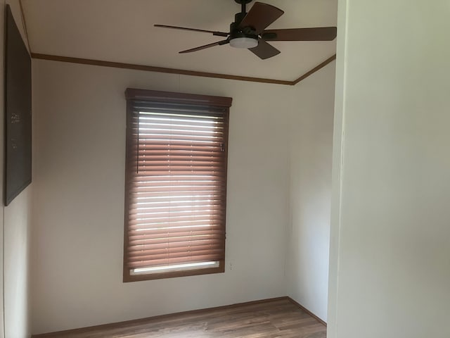 515 E Pond Vw, Morrice, MI 48857 - empty room featuring ceiling fan, ornamental molding, and wood finished floors