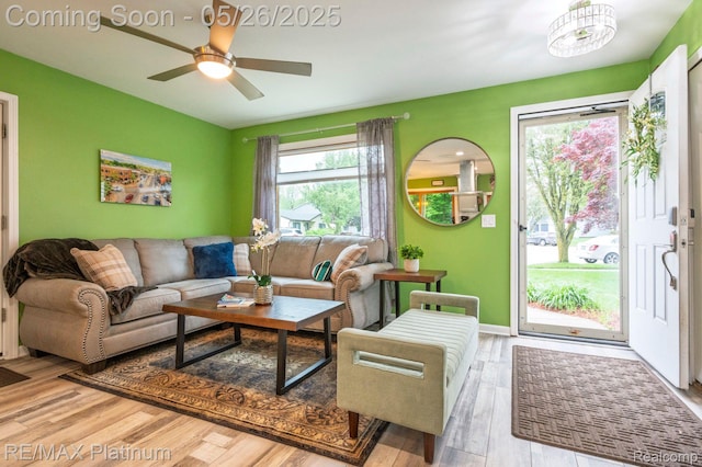 638 Glenwyth Rd, Brighton, MI 48116 - living room with wood finished floors, a ceiling fan, and baseboards