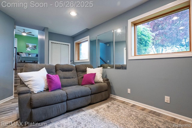 638 Glenwyth Rd, Brighton, MI 48116 - living room with a ceiling fan, wood finished floors, and baseboards