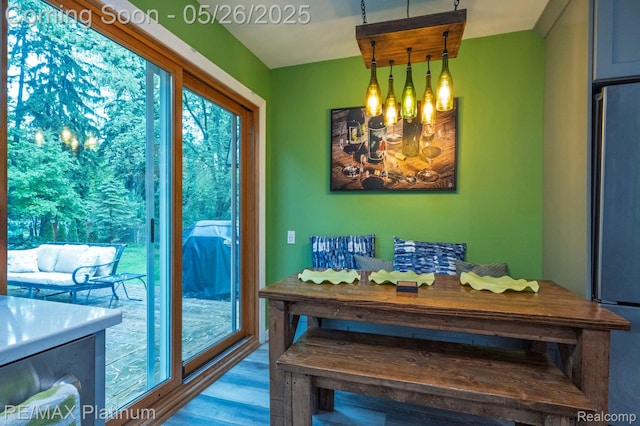 638 Glenwyth Rd, Brighton, MI 48116 - dining room with a chandelier and wood finished floors