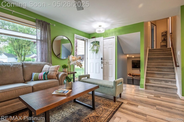 638 Glenwyth Rd, Brighton, MI 48116 - living room with stairs, healthy amount of natural light, and wood finished floors
