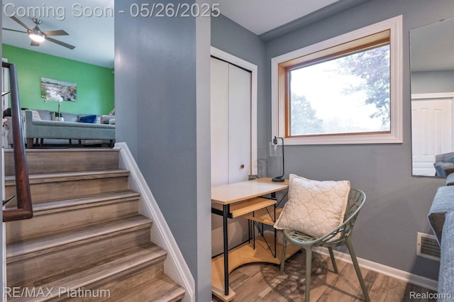 638 Glenwyth Rd, Brighton, MI 48116 - stairway featuring a ceiling fan, baseboards, and wood finished floors
