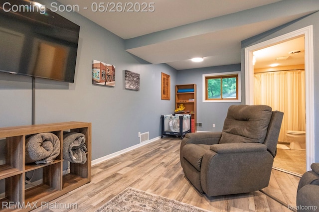 638 Glenwyth Rd, Brighton, MI 48116 - living area featuring wood finished floors and baseboards