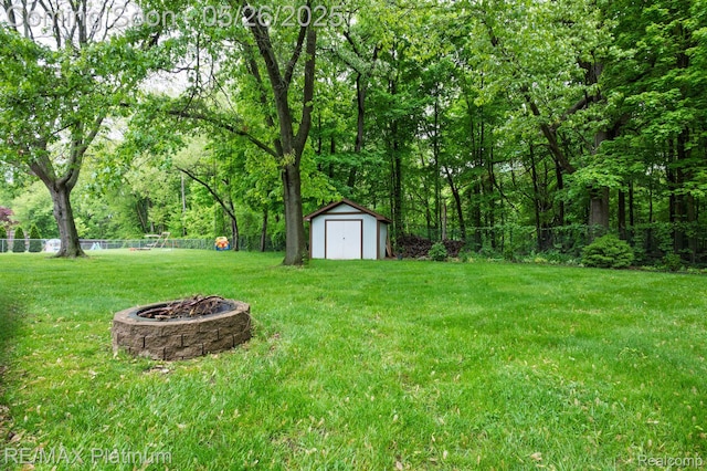 638 Glenwyth Rd, Brighton, MI 48116 - view of yard with an outdoor fire pit