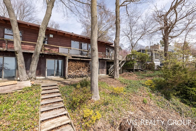 17933 N Shore Estates Rd, Spring Lake, MI 49456 - rear view of house with stairs and a deck