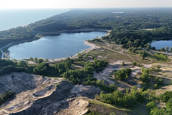 17933 N Shore Estates Rd, Spring Lake, MI 49456 - aerial view of property and surrounding area with a large body of water and a forest