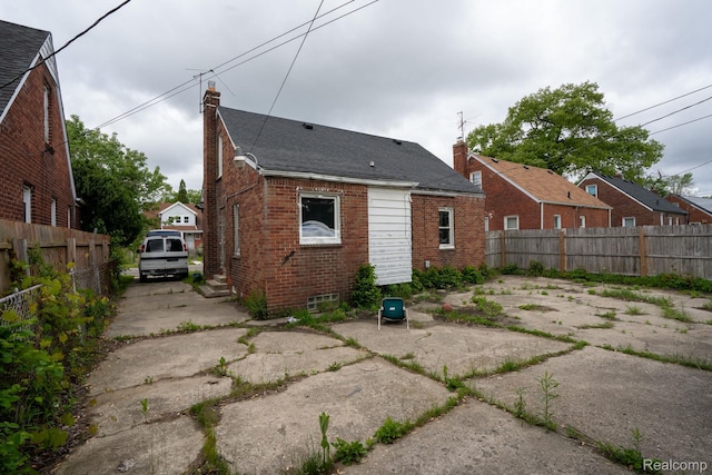 19610 Norwood St, Detroit, MI 48234 - back of property featuring a chimney and brick siding