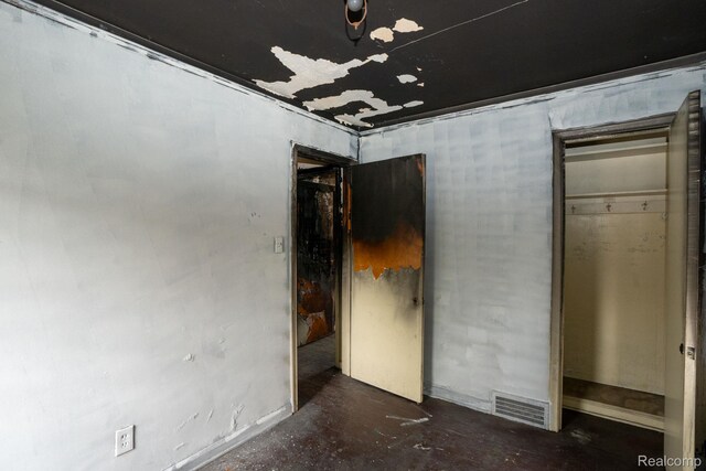 19610 Norwood St, Detroit, MI 48234 - unfurnished bedroom featuring unfinished concrete floors