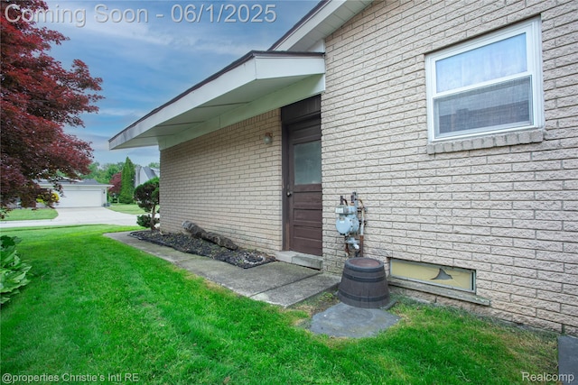 30571 Cedars Dr, Warren, MI 48093 - view of property exterior with a lawn and brick siding