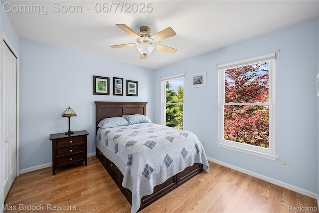 9863 Marshall Rd, South Lyon, MI 48178 - bedroom featuring light wood-style flooring, baseboards, a closet, and ceiling fan