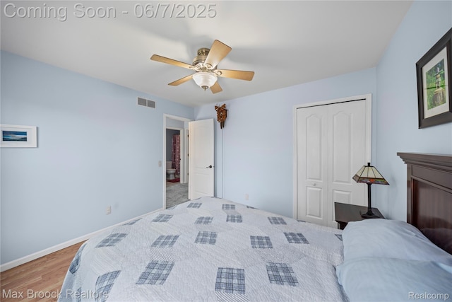 9863 Marshall Rd, South Lyon, MI 48178 - bedroom with a closet, baseboards, ceiling fan, and wood finished floors