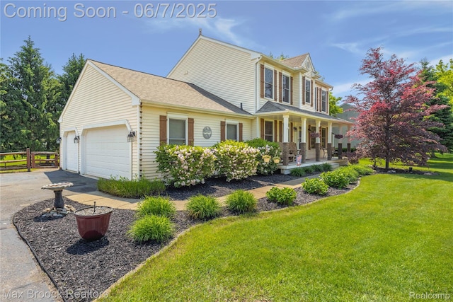 9863 Marshall Rd, South Lyon, MI 48178 - view of front of house with a porch, driveway, and a garage