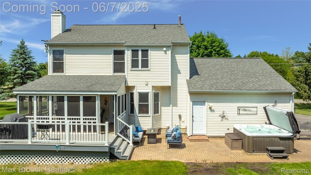 9863 Marshall Rd, South Lyon, MI 48178 - back of property with a hot tub, a sunroom, a chimney, a wooden deck, and a shingled roof