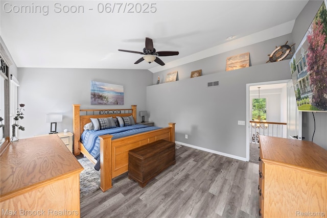 9863 Marshall Rd, South Lyon, MI 48178 - bedroom with wood finished floors, lofted ceiling, and ceiling fan