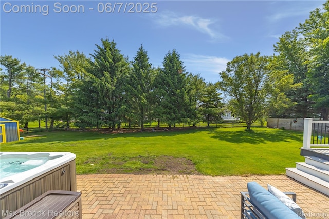 9863 Marshall Rd, South Lyon, MI 48178 - view of yard featuring a hot tub, a patio area, view of wooded area, and an outdoor structure