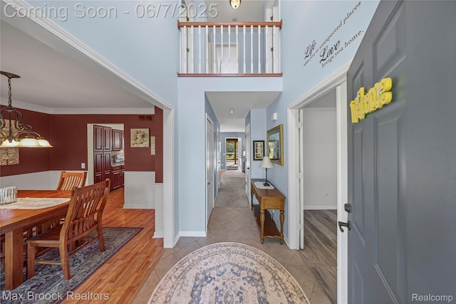 9863 Marshall Rd, South Lyon, MI 48178 - entryway with a chandelier and light wood finished floors